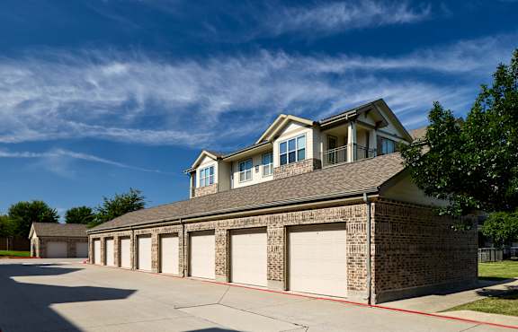 A large two-story house with a garage.