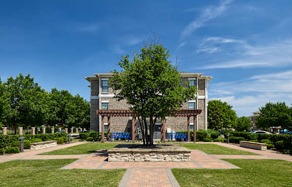 A large building with a tree in front of it.