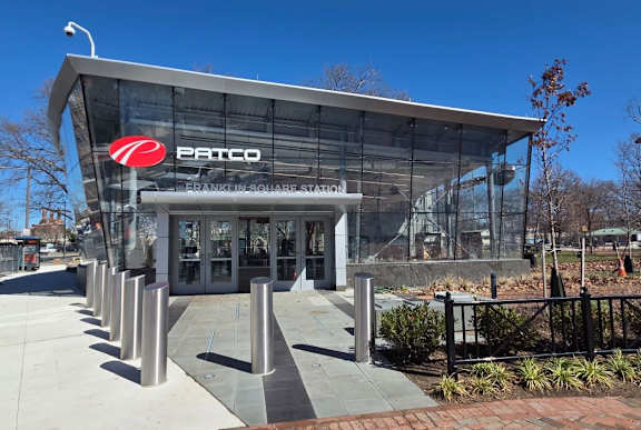 The Patco building has a glass facade and a red logo at The View at Old City, Philadelphia, PA