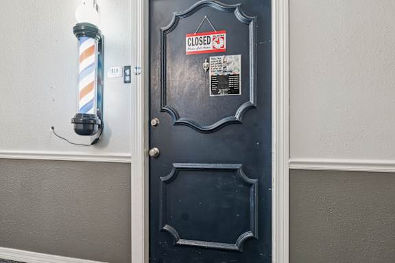 Closed door with a sign on it that says closed at Esplanade at City Park, New Orleans, Louisiana