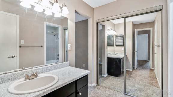 Bathroom with Vanity and Closet at The Willows on Rosemeade, Dallas, TX 75287