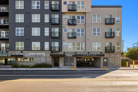 A multi-story building with a sushi restaurant on the ground floor.