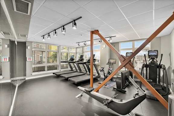 A gym with treadmills and exercise equipment.