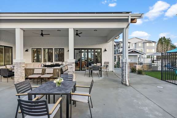 A patio with a table and chairs is shown.