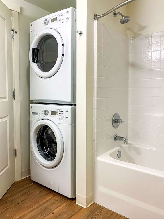 A white washer and dryer in a Ruth Court apartment bathroom.