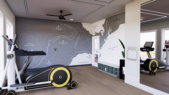 A room with a wall map of the United States and a treadmill.