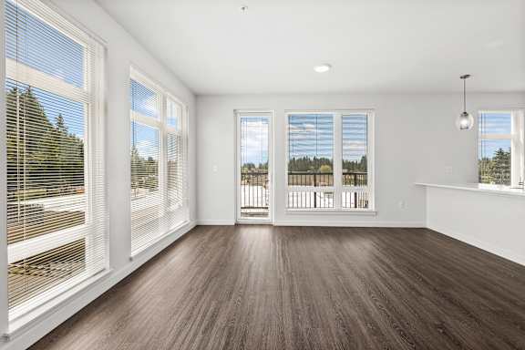 A room with wooden floors and white walls.