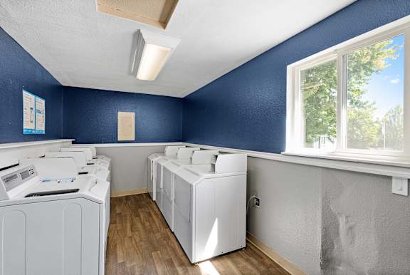 A laundry room with a washer and dryer.