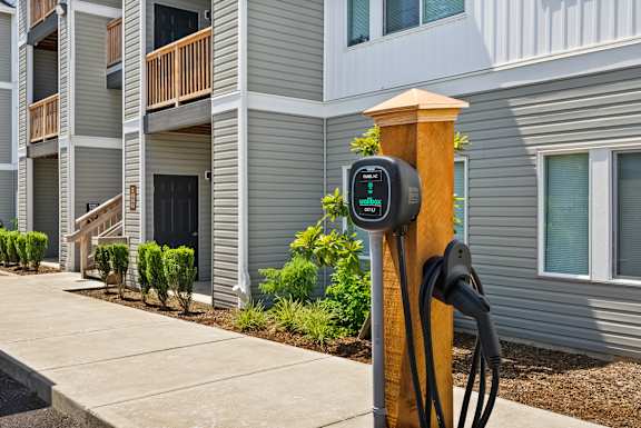 A charging station for electric vehicles is installed in front of a building.
