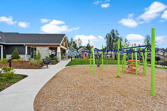 A playground with a swing set and a slide.