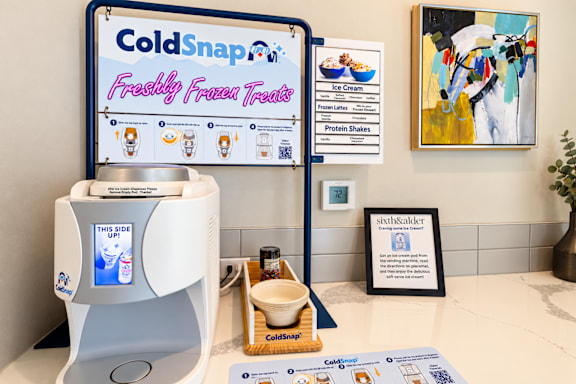 A machine that dispenses frozen treats is on display.