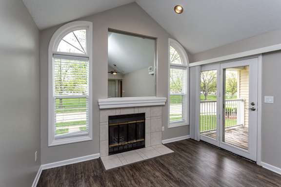 A room with a fireplace and a sliding glass door.
