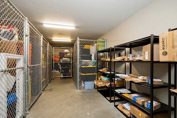 A storage room with shelves and boxes.