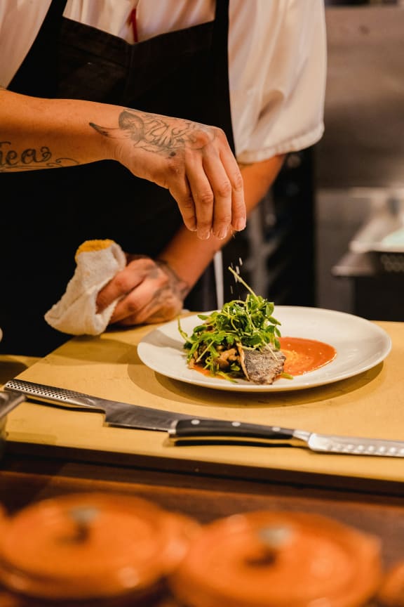 a plate being prepared in a restaurant