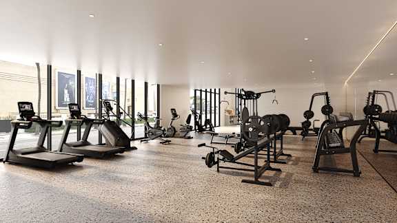 A gym with a variety of equipment including treadmills, weights, and exercise machines.at WM by CLG, Los Angeles California