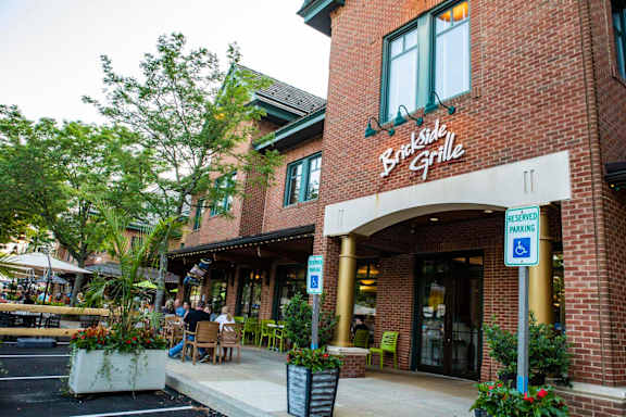 A restaurant named Brickside Grille has reserved parking.