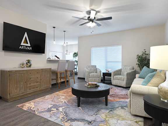 A living room with a rug on the floor and a sign that says "ARTIAN" on the wall.