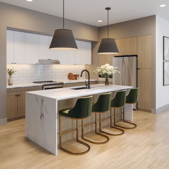 a kitchen with a marble counter top and four green chairs at Bemiston Place Apartments, Clayton, 63105