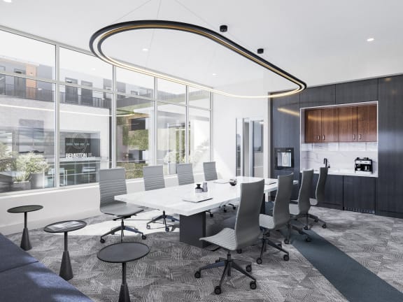 a conference room with a white table and chairs
