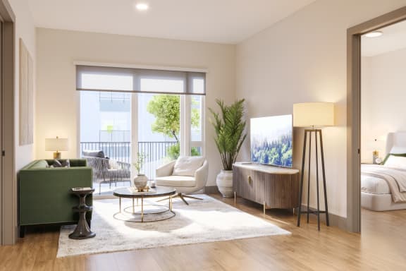 a living room with a couch and a chair and a tv at Bemiston Place Apartments, Clayton, MO