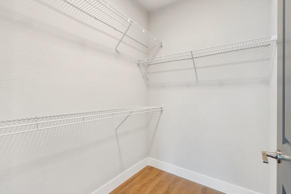 Empty white shelves in a room.