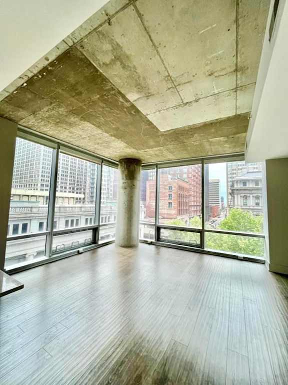 Floor to ceiling windows in the living room looking onto the plaza below and down 8th street towards Ballpark Village