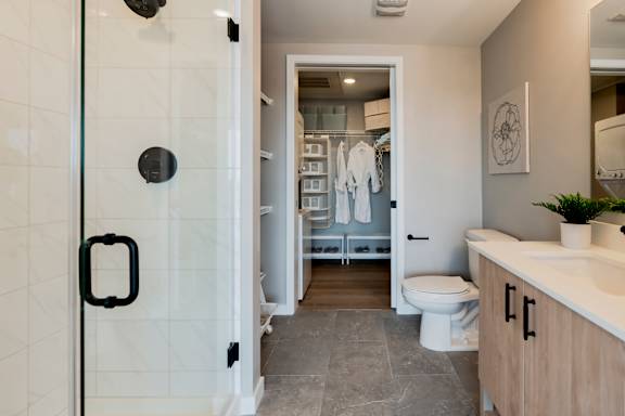 A bathroom with a walk in shower and a toilet. at One Foundry Way Apartments, St Louis, MO, 63110