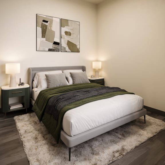 a bedroom with a bed and a rug at The Porter, Maryland Heights, 63146
