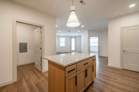 A kitchen with wooden cabinets and a central island.