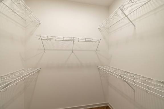 Empty white shelves in a room.
