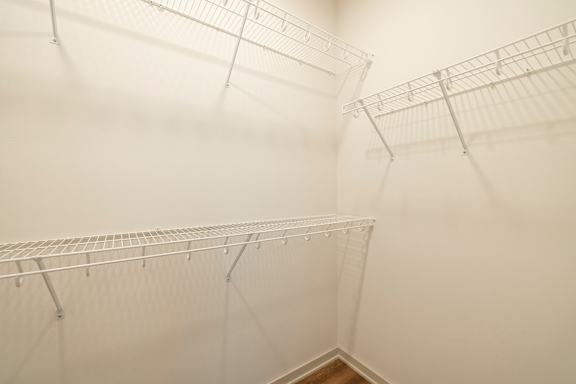 Empty wire shelves in a room.