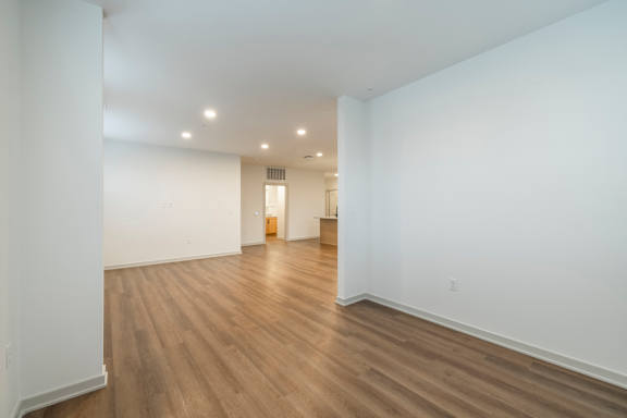 A room with wooden floors and white walls.