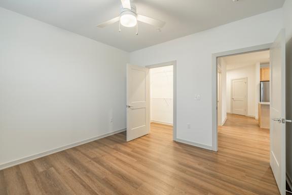 A room with wooden floors and white walls.