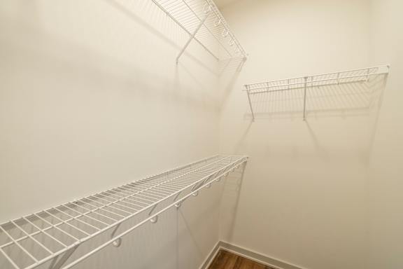 Empty wire shelving in a room.