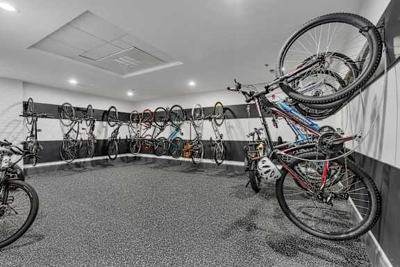 A bike shop with many bikes hanging on the wall.