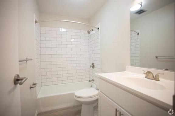 Renovated bathroom with subway tile.