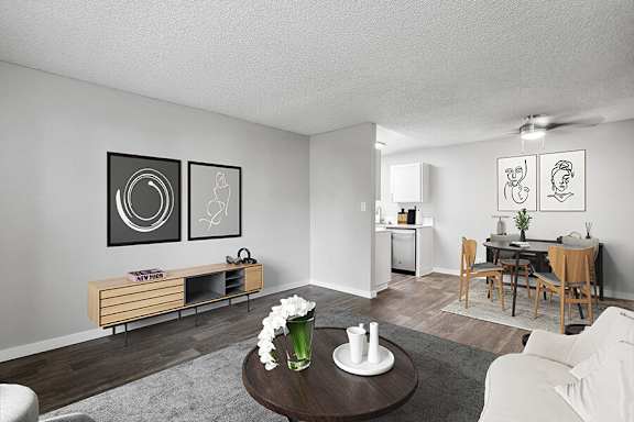 Model Living Room with Carpet and Wood-Style Flooring at The Archer Apartments in Sacramento, CA.
