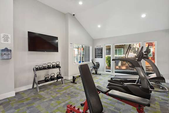 Community Fitness Center with Equipment at The Archer Apartments in Sacramento, CA.