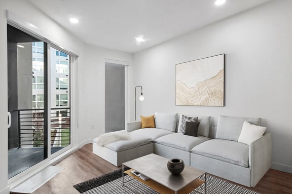 Model living room with sofas at Post House North located in Post District Residences in downtown Salt Lake City, Utah
