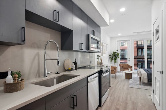 Model kitchen at at Post House North located in Post District Residences in downtown Salt Lake City, Utah