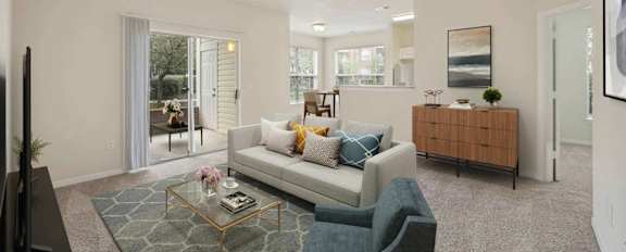 A living room with a couch, coffee table, and sliding glass doors.