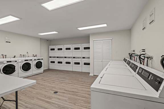 Laundry with White Machines at Atlantic Pointe Apartments, Atlantic Highlands, New Jersey