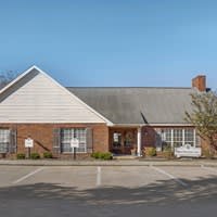 Small Building with Parking Lot at Arbors at Natchez Trace Apartments, Ridgeland