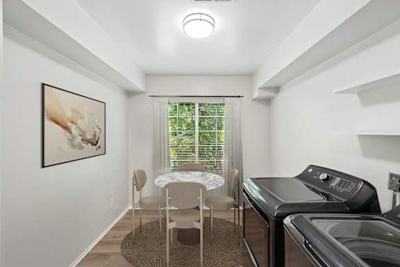 A laundry room with a washer and dryer.