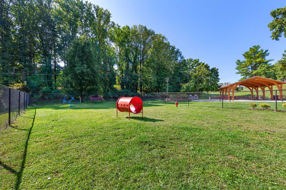a park with a playground and a swing set at Copper and Quarry Village, Pikesville, Maryland
