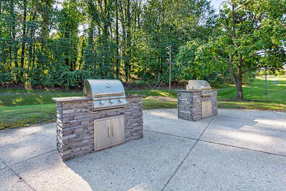 two barbecue pits in a park at Copper and Quarry Village, Pikesville, 21209