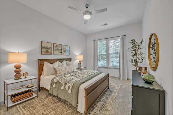 A Bedroom with a Nightstand at District 757 Apartments, Norfolk, 23502