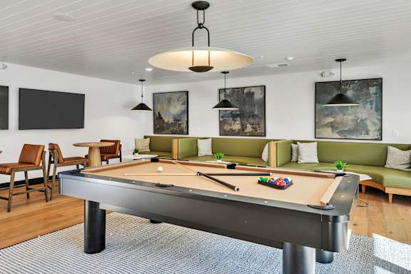 A Pool Table is in the Middle of a Room at District 757 Apartments, Norfolk, Virginia