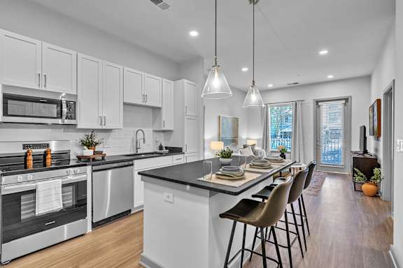 A Kitchen with a Large Island at District 757 Apartments, Norfolk, VA, 23502