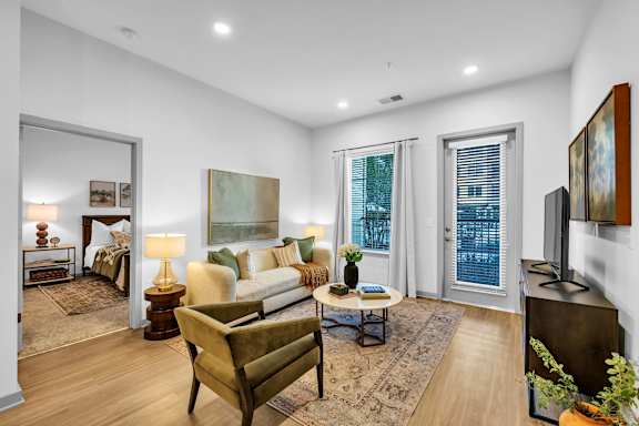 A Living Room with a Painting on the Wall at District 757 Apartments, Norfolk, VA